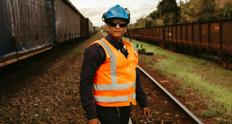 A Railroad Worker Posing on the Train Tracks - Sentinel Compliance