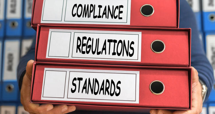 Regulations, Compliance, Standards, concept words. Folder concept. Ring binders - Key ISO Standards