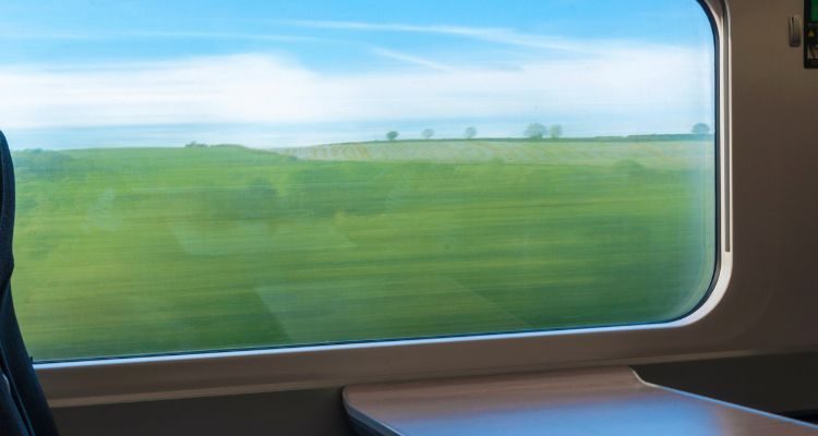 the view if the UK landscape through a train window