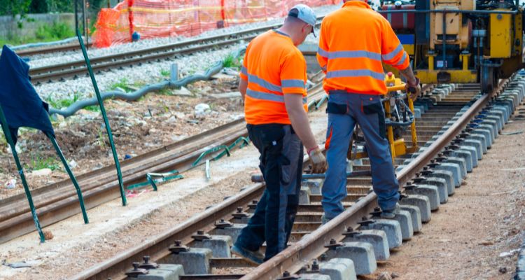 Engineer at work - UK Railway Engineers carrying out maintenance work on the UK railway tracks